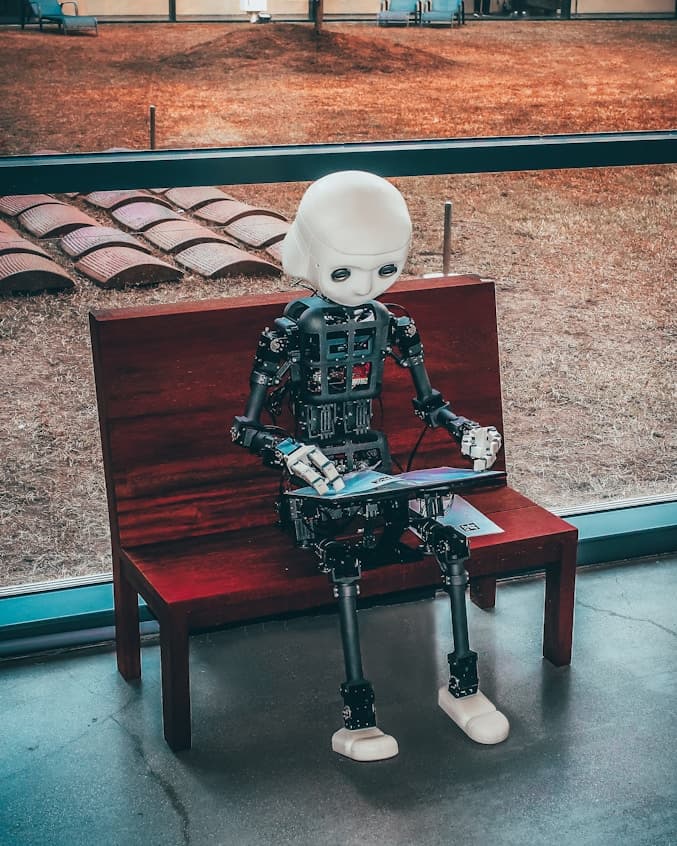 Humanoid robot on a bench — AI in the real world